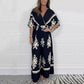 Női V-nyakú széles szárú Jumpsuit